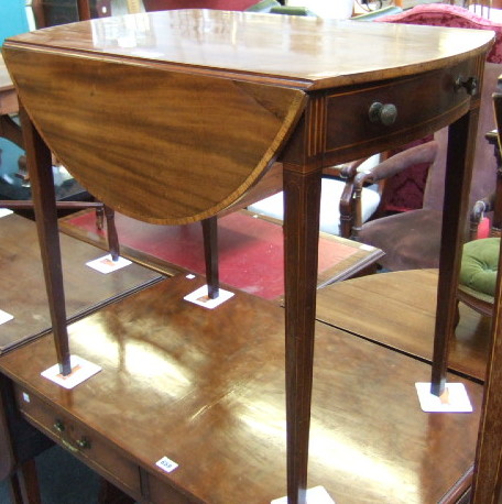 Appraisal: A George III mahogany and satinwood banded oval Pembroke table