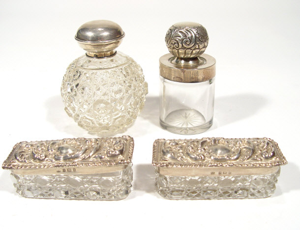 Appraisal: Four cut glass boxes and bottles with silver mounts comprising