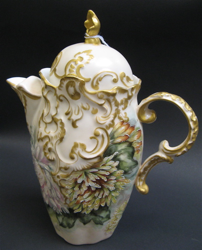 Appraisal: VIENNA AUSTRIA PORCELAIN PITCHER hand painted chrysanthemums gold scrolls and