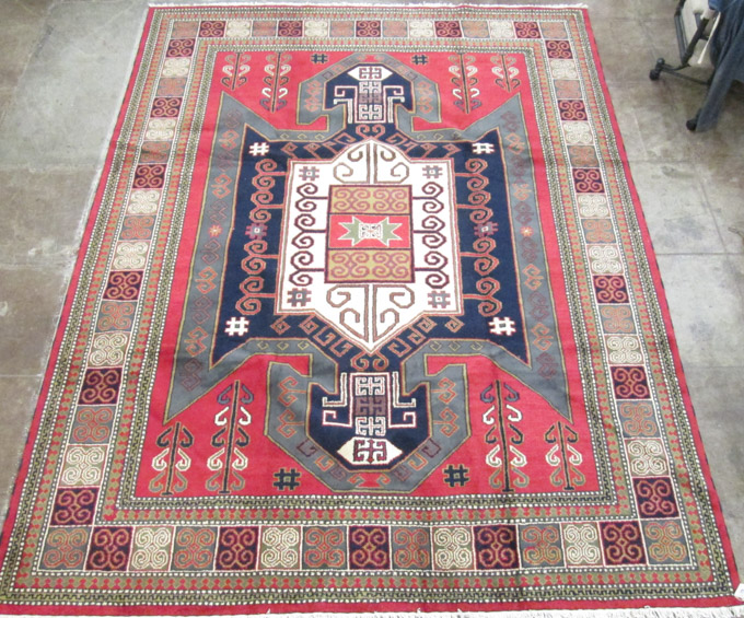 Appraisal: HAND KNOTTED ORIENTAL CARPET Indo-Caucasian featuring an extra large central