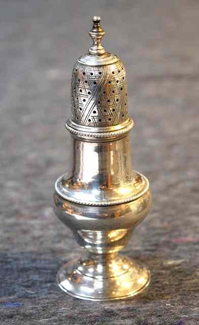 Appraisal: A GEORGE III BALUSTER SHAPED CASTER on a turned stepped