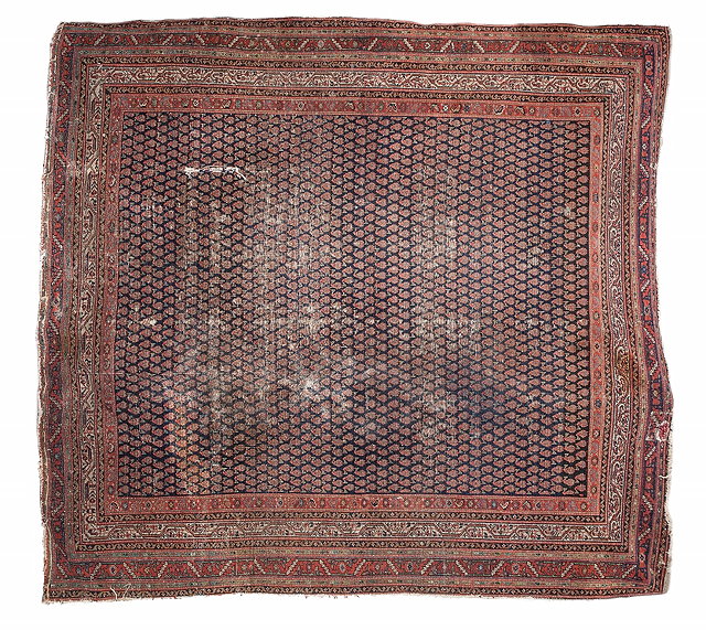 Appraisal: AN ANTIQUE HAMADAN BLUE GROUND RUG with a central intense