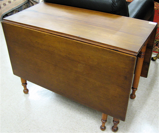 Appraisal: LATE VICTORIAN DROP-LEAF DINING TABLE American th century having a