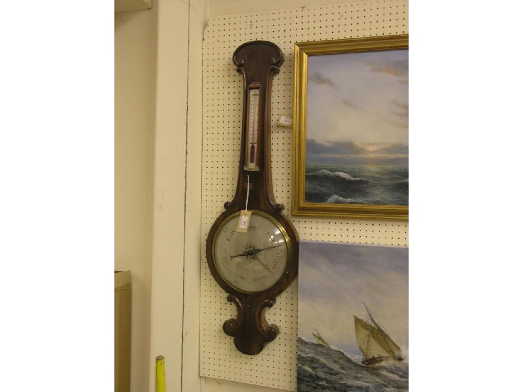 Appraisal: An early Victorian mahogany wheel barometer with silvered thermometer and