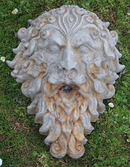 Appraisal: A CONCRETE FLOWER MOULDED SUNDIAL with circular bronze dial plate