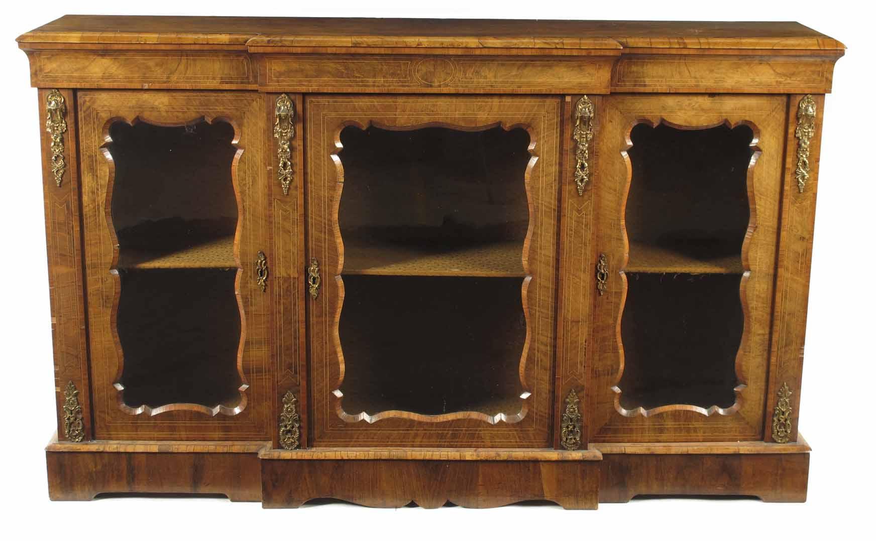 Appraisal: A Victorian walnut breakfront side cabinet