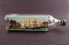 Appraisal: SHIP-IN-A-BOTTLE - Four Mast Ship with following tug passing coast