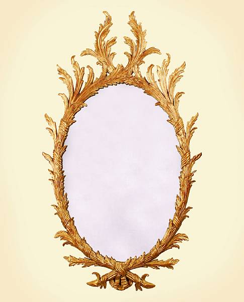 Appraisal: A pair of George III style giltwood oval mirrors Each