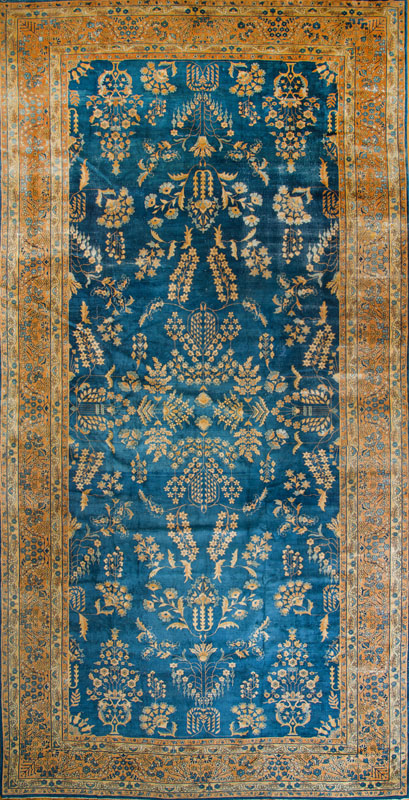 Appraisal: PERSIAN LONG CARPET The light blue field worked with willow