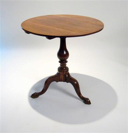 Appraisal: George II walnut tilt-top table The circular top raised on