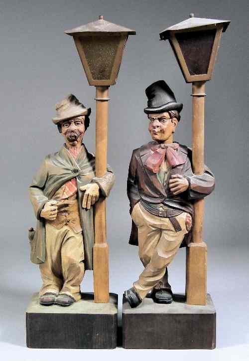 Appraisal: A pair of Continental carved and painted ''Whistling'' wooden figures