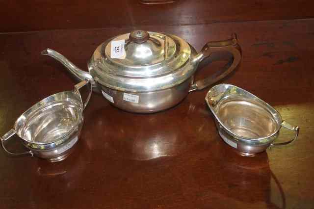 Appraisal: A SILVER PIECE TEA SET of oval baluster form engraved