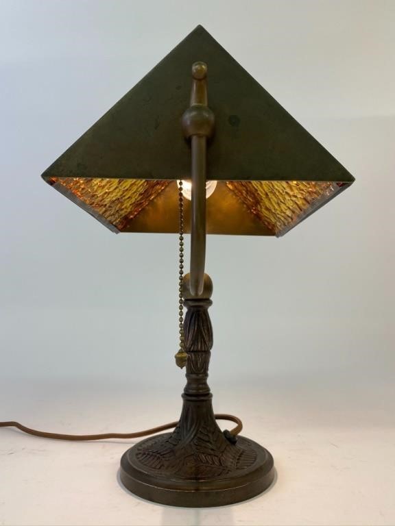 Appraisal: Faux bronze desk lamp with amber glass shade with trees