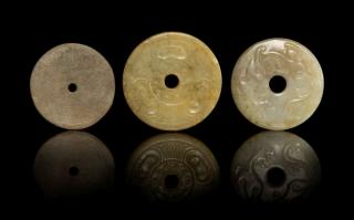 Appraisal: Three Jade Bi Discs Three Jade BiDiscs the first carved