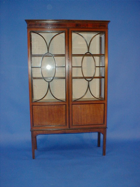 Appraisal: An Edwardian string inlaid mahogany display cabinet with two astragal