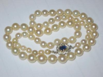 Appraisal: A CULTURED PEARL NECKLACE the graduated pearls with diamond and