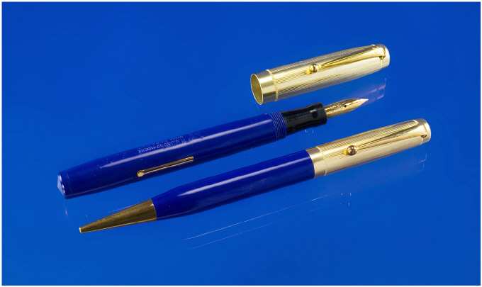 Appraisal: Swan A Swan pen and pencil set in royal blue