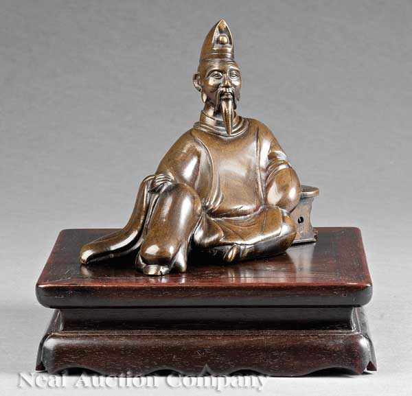 Appraisal: A Chinese Bronze Figure of a Scholar bearded figure modeled