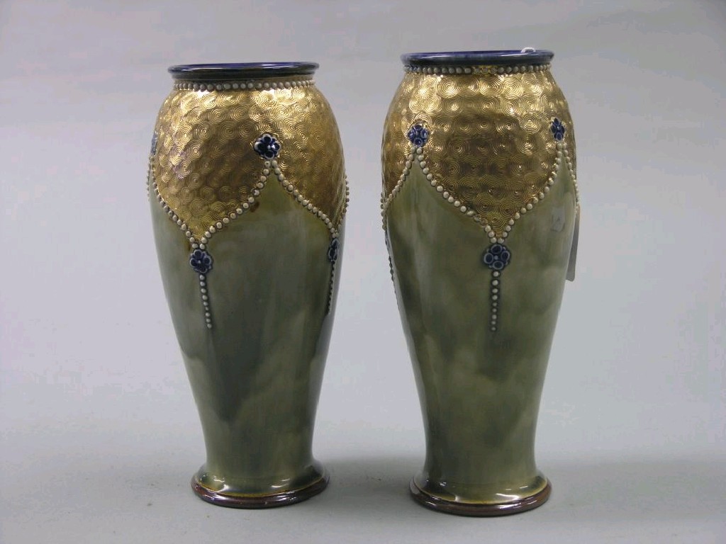 Appraisal: A pair of Royal Doulton glazed stoneware vases slim baluster-shape