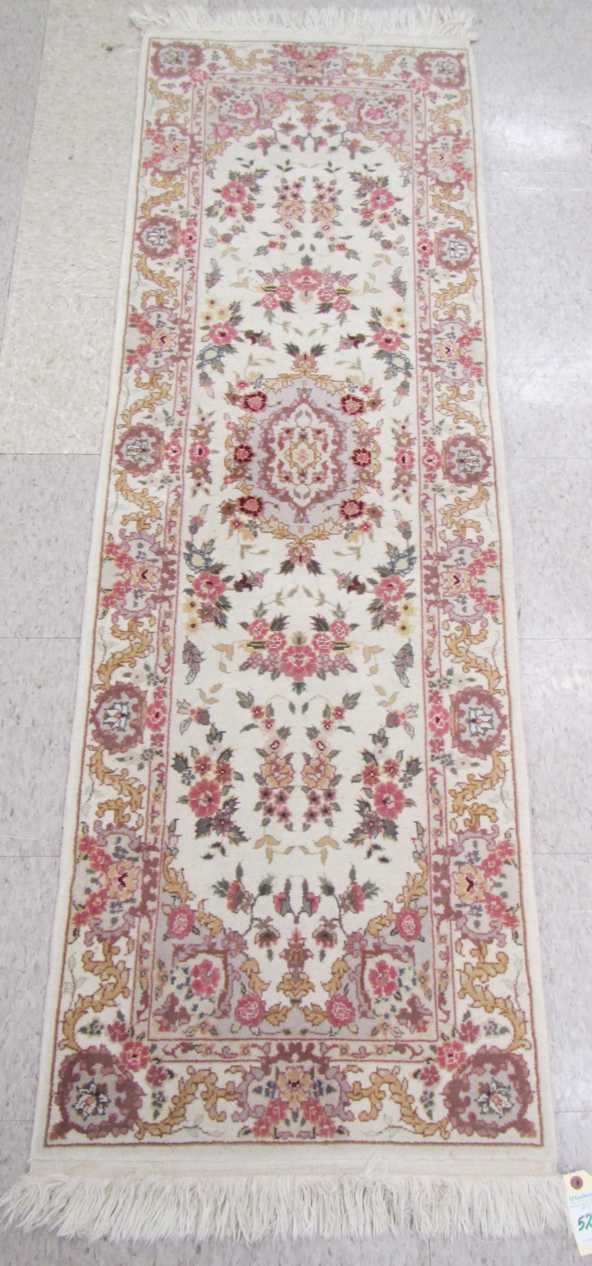 Appraisal: HAND KNOTTED ORIENTAL RUNNER Pakistani-Persian floral and central floral medallion