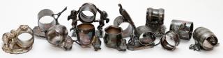 Appraisal: SILVERPLATE NAPKIN RINGS AND TOOTHPICK HOLDERS SILVERPLATE FIGURAL NAPKIN RINGS