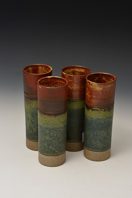 Appraisal: Robin Welch British b Four beakers graduated red to green