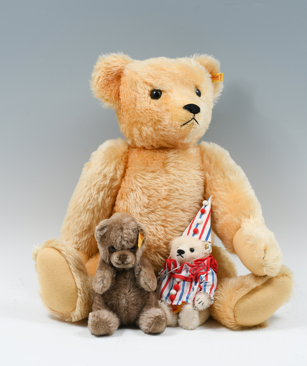 Appraisal: GERMAN STEIFF TEDDY BEARS Comprising - Large Reticulated bear -