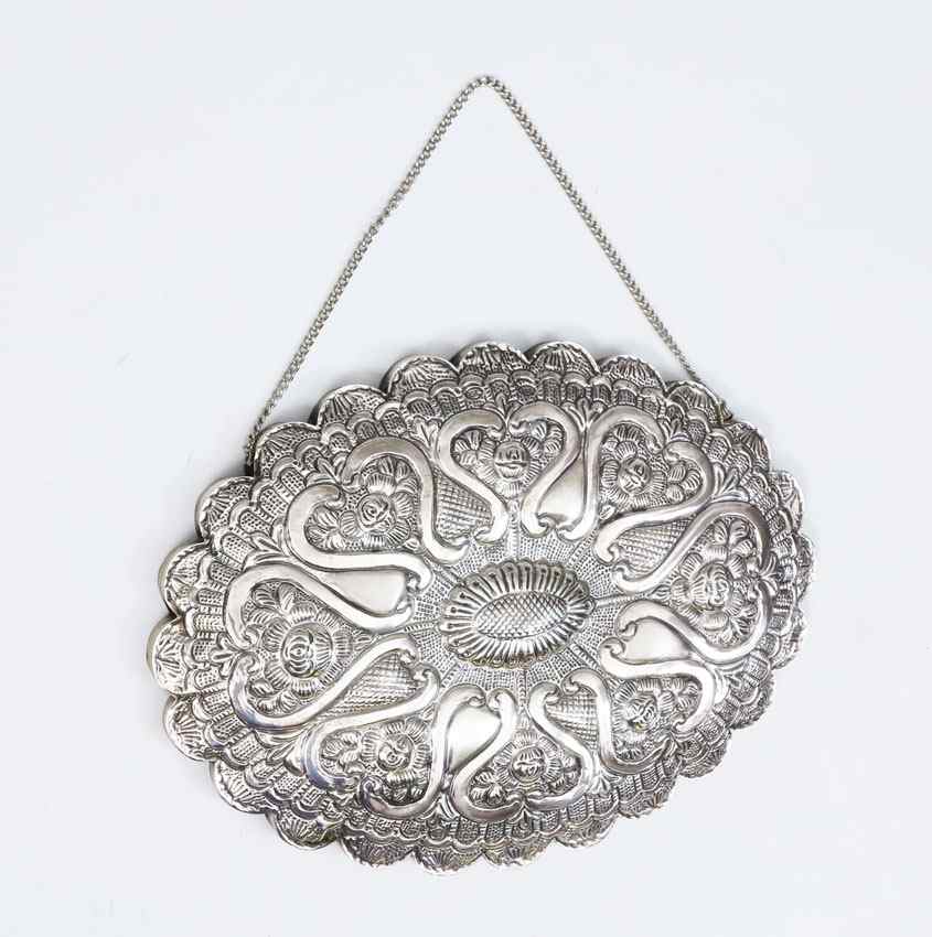 Appraisal: EMBOSSED STERLING FRAME MIRROR WITH CHAIN Engraved front with embossed