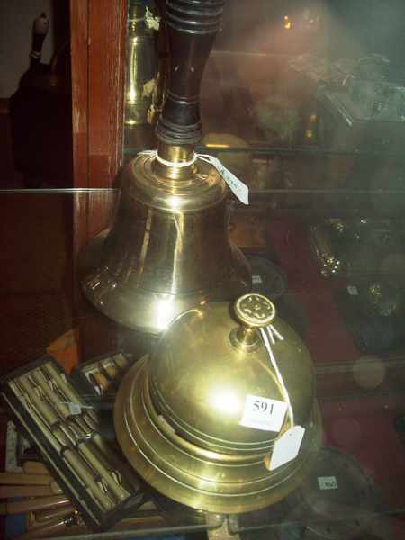 Appraisal: A VICTORIAN BRASS COUNTER BELL AND A LARGE HAND BELL