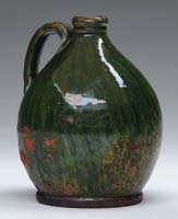 Appraisal: GREEN GLAZED REDWARE HANDLED JUG The small jug having streaky