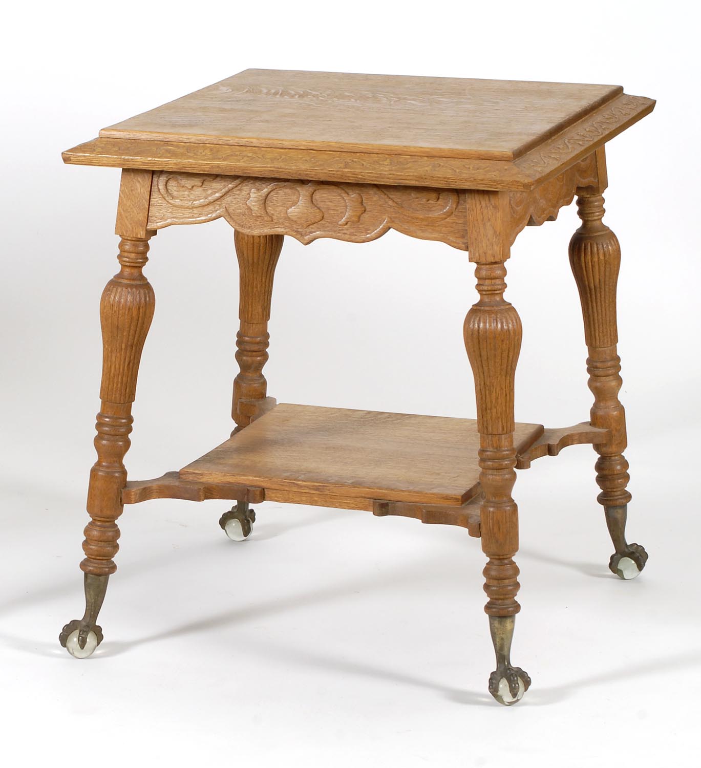 Appraisal: GOLDEN OAK LAMP TABLE with glass ball claw feet reeded