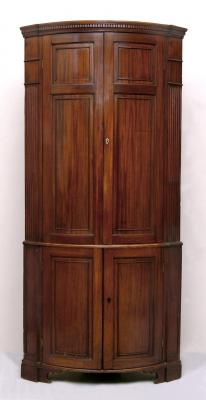 Appraisal: A GEORGE III MAHOGANY STANDING CORNER CUPBOARD of bowed form