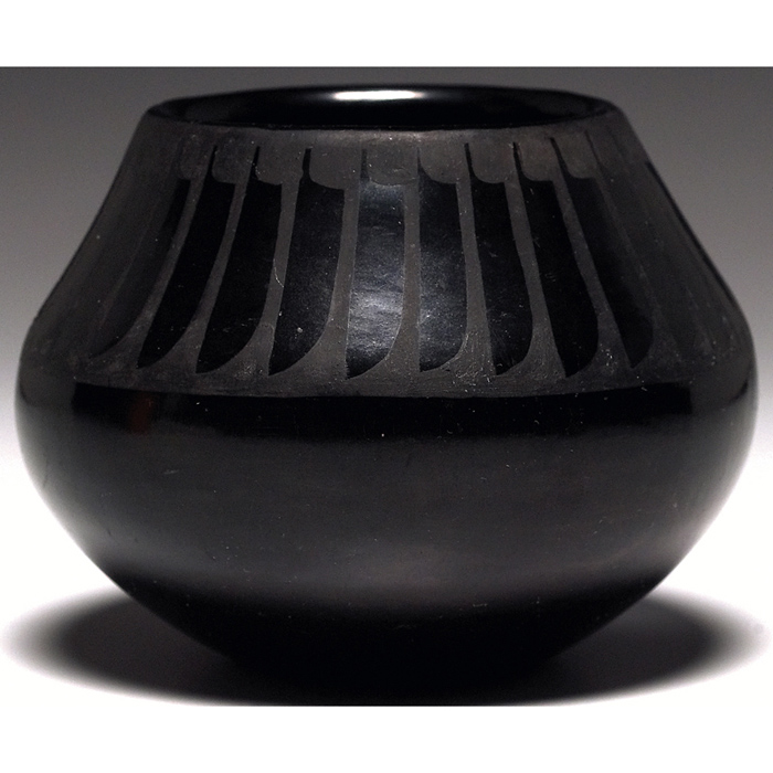 Appraisal: San Ildefonso vase polished black with a stylized feather design