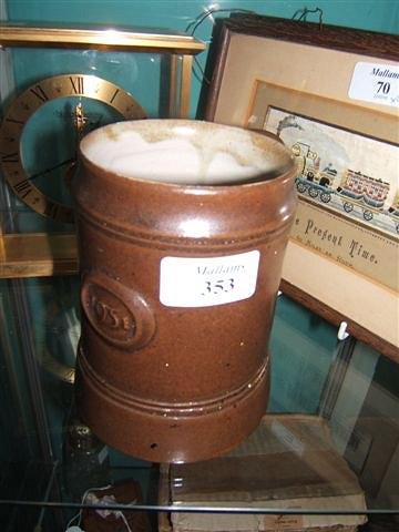 Appraisal: A Michael Cardew brown glazed pottery tankard dated with impressed