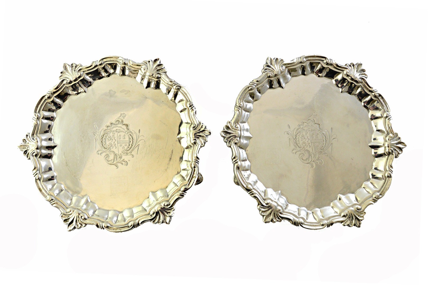 Appraisal: A pair of George II silver shaped circular waiters each