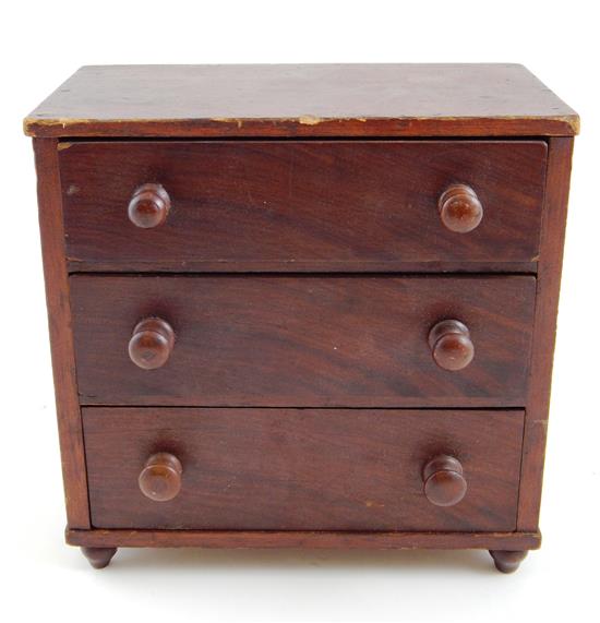 Appraisal: th C American miniature three drawer chest grain painted finish