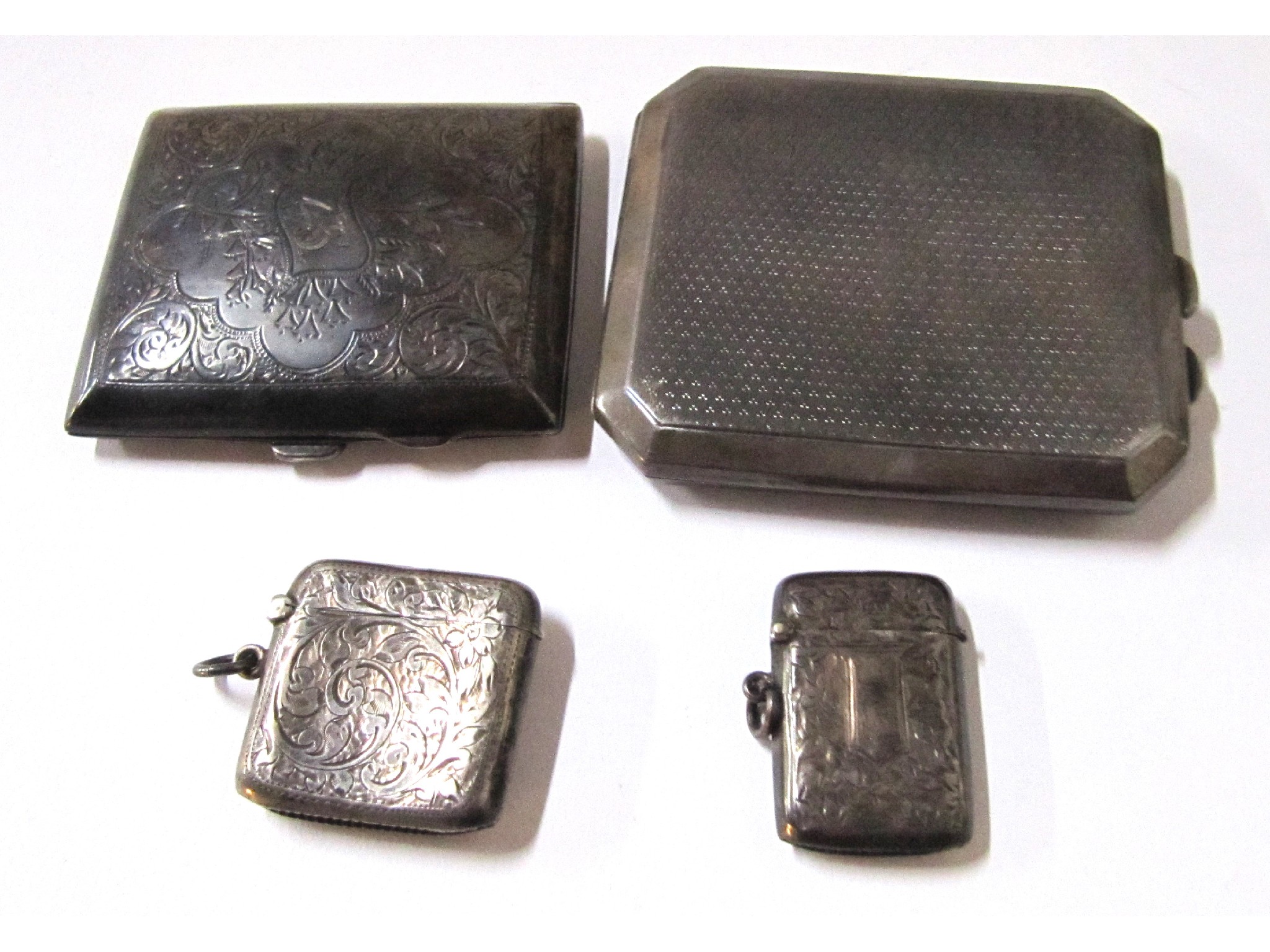 Appraisal: A lot comprising two silver cigarette cases and two silver