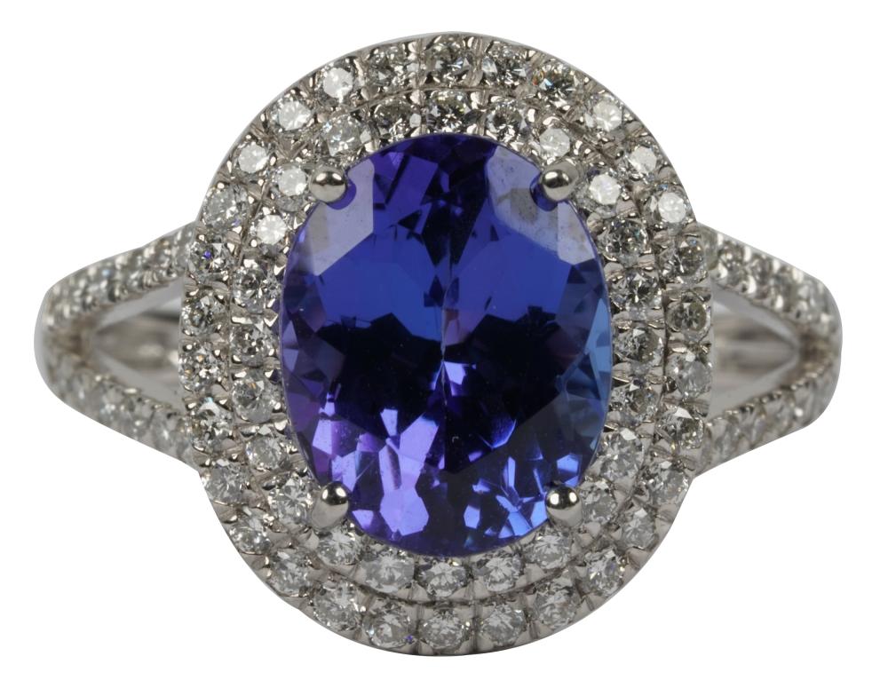 Appraisal: PLATINUM DIAMOND TANZANITE RINGcentering one oval tanzanite weighing approximately carats