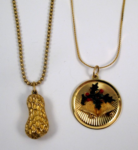 Appraisal: TWO FOURTEEN KARAT GOLD PENDANT NECKLACES including a round holiday