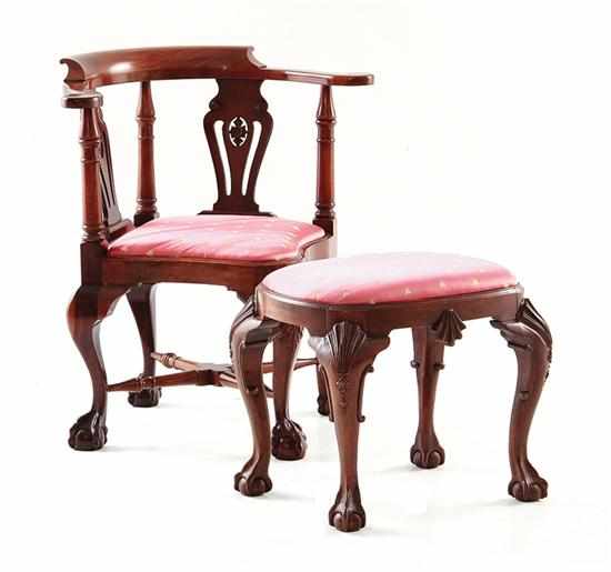 Appraisal: Georgian style mahogany corner chair and Baker footstool continuous raised