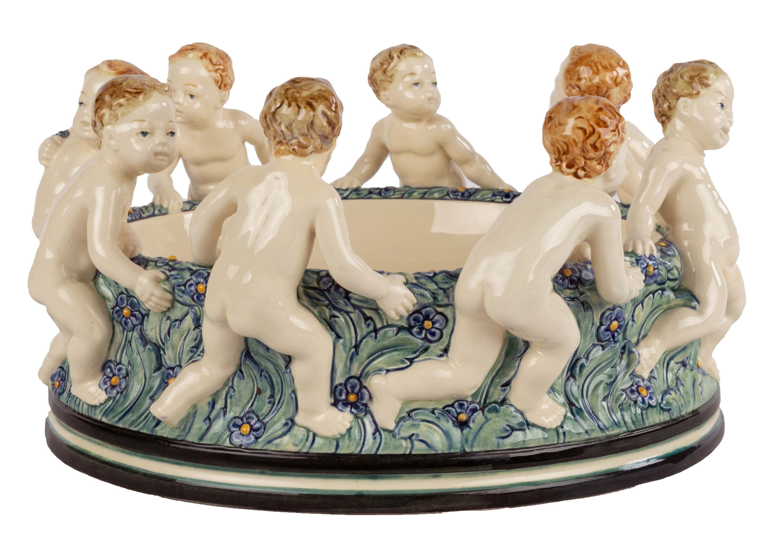 Appraisal: WILHELM SUS MAJOLICA CENTERPIECE WITH PUTTO Kahlsruhe Majolica mark impressed