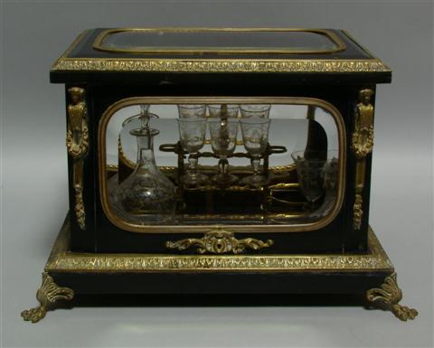 Appraisal: CONTINENTAL NEOCLASSICAL STYLE EBONIZED CELLARETTE The rectangular casket set atop