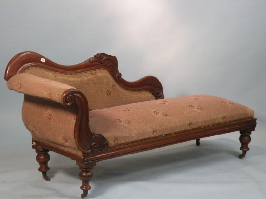 Appraisal: A Victorian mahogany chaise longue with a padded back arm