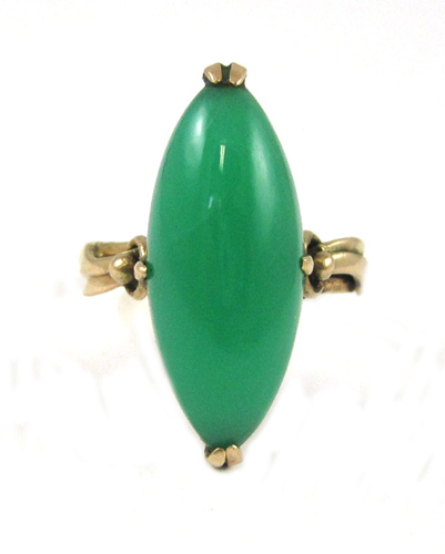 Appraisal: GREEN JADE AND FOURTEEN KARAT GOLD RING featuring a marquise