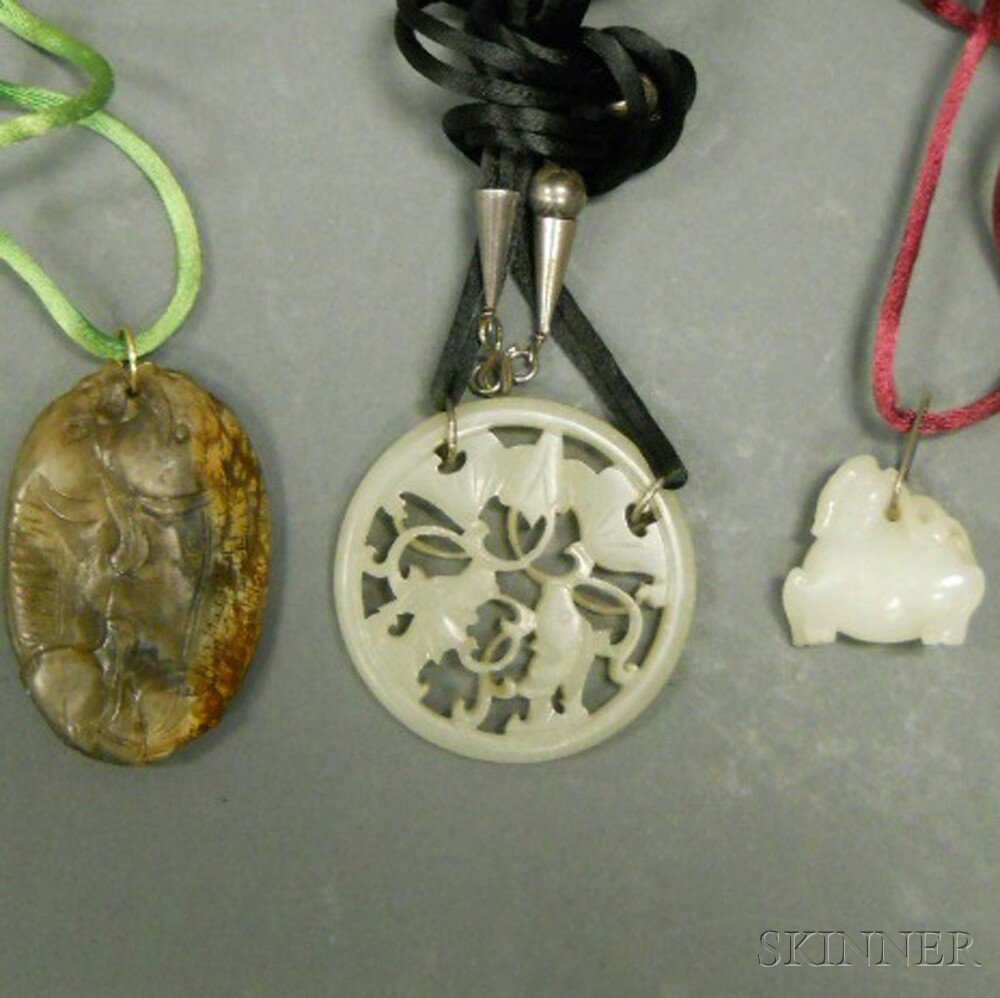 Appraisal: Three Hardstone Pendants China a white jade with openwork roundels