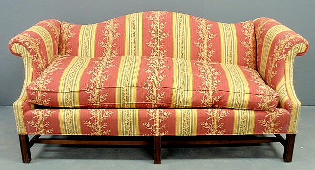 Appraisal: Chippendale style mahogany camelback sofa with down cushion and upholstery