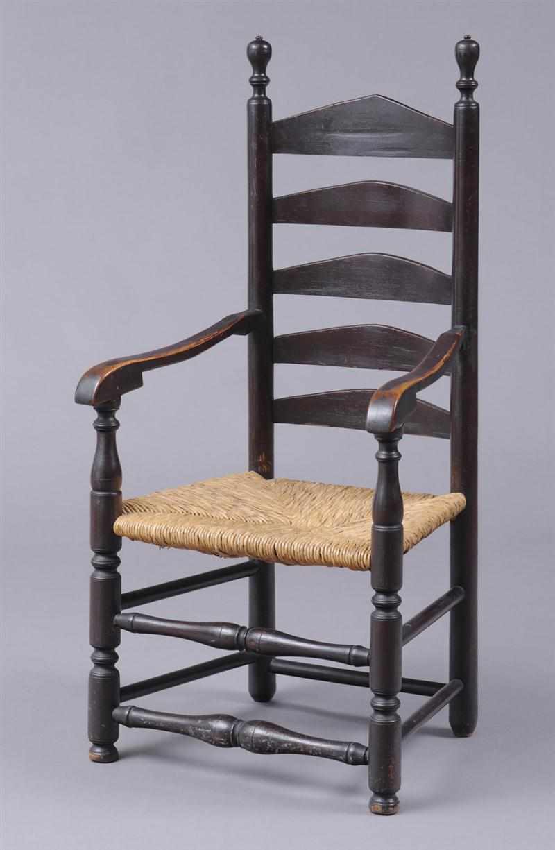 Appraisal: PENNSYLVANIA STAINED LADDER-BACK ARMCHAIR The five splats on turned uprights