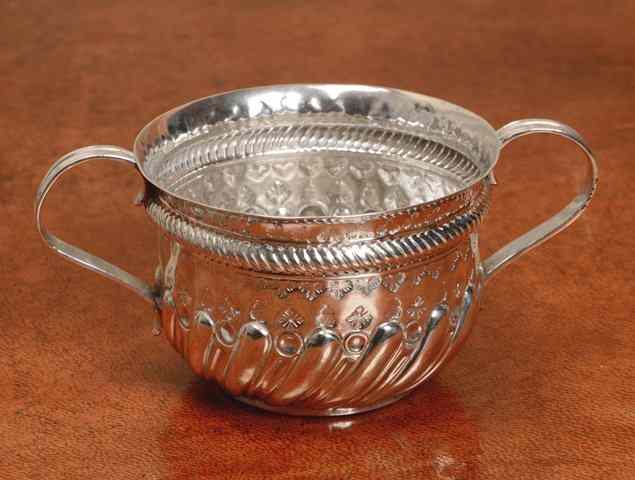 Appraisal: A VICTORIAN SILVER QUEEN ANNE STYLE PORRINGER with a chased