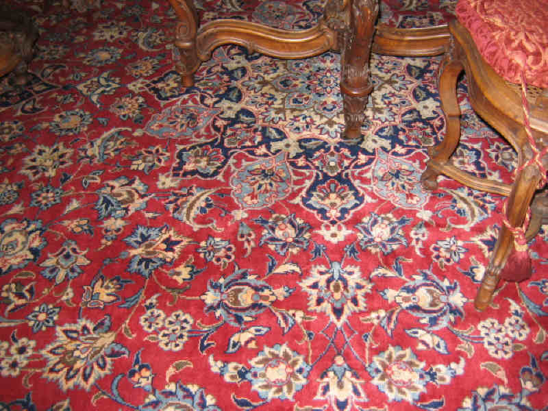 Appraisal: KASHAN ROOM RUG The red field of floral design shows