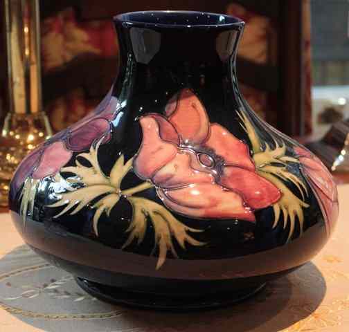 Appraisal: A MOORCROFT DARK BLUE GROUND VASE of squat ovoid form